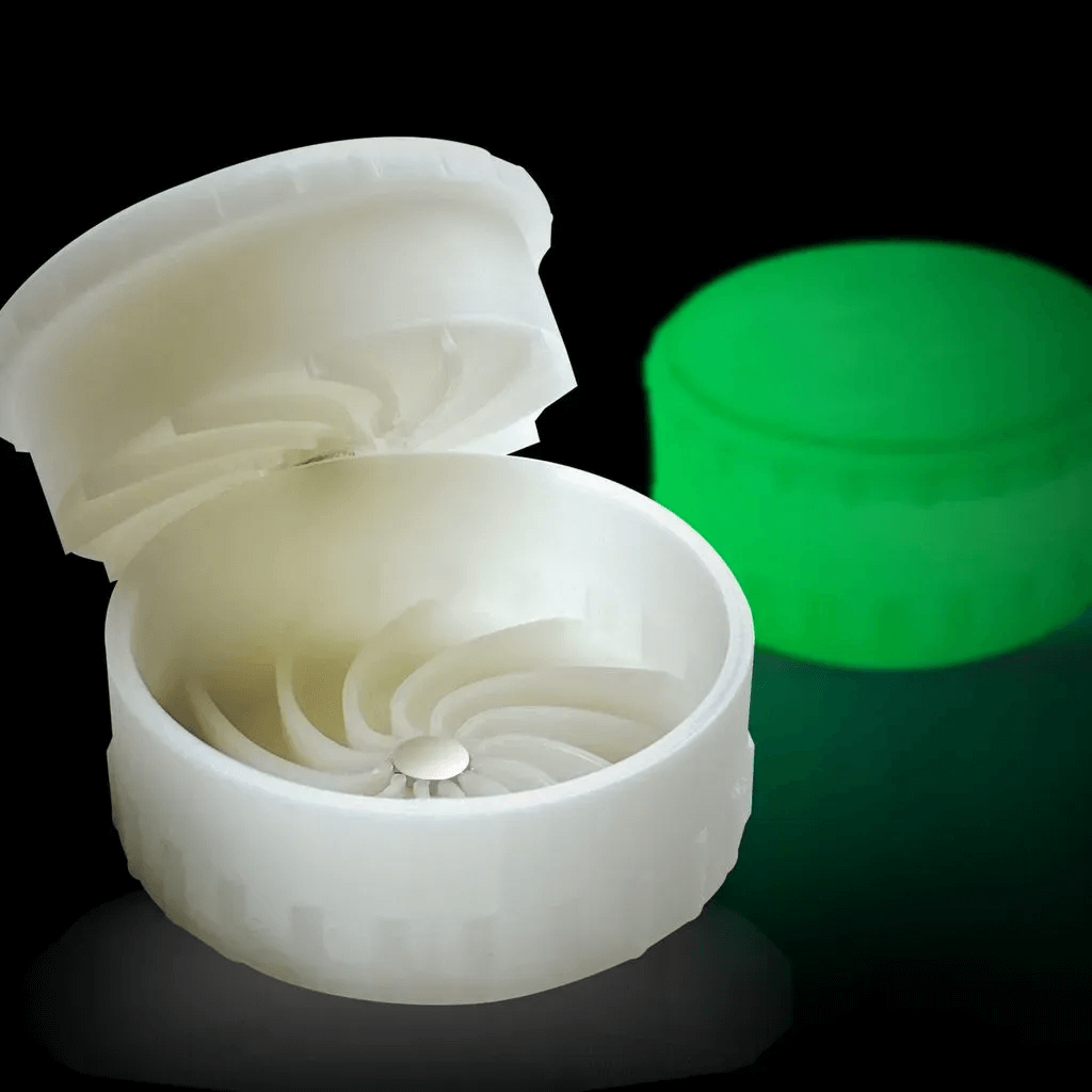 Genius Grinder with closed glow-in-the-dark effect in background