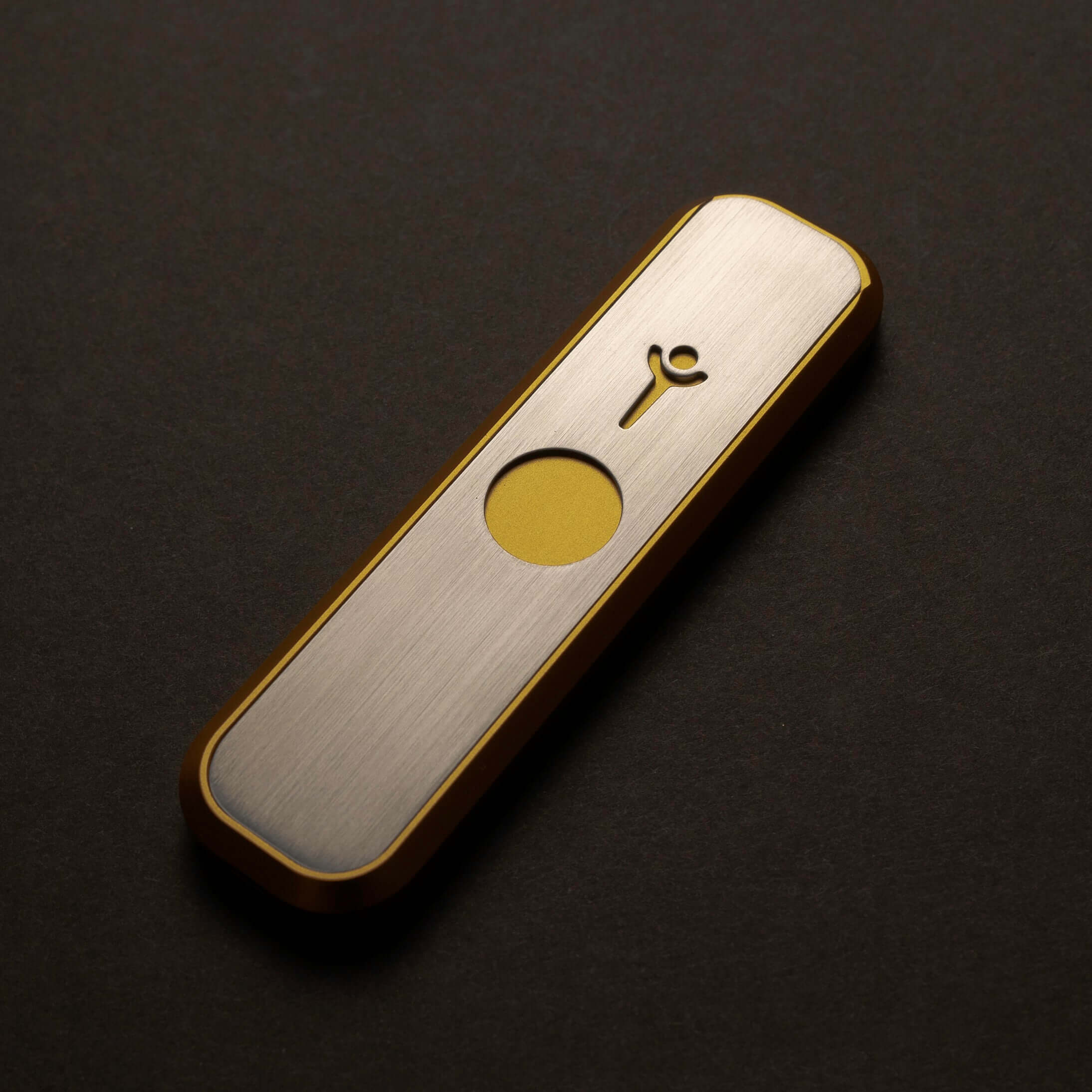 Genius Pipe Mini Gold fully assembled on felt tabletop β closed view.