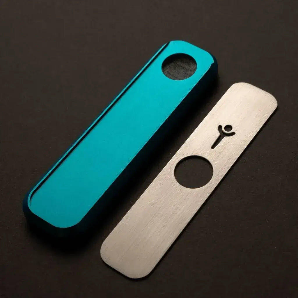 Genius Pipe Mini Teal with magnetic slider removed and placed beside device.